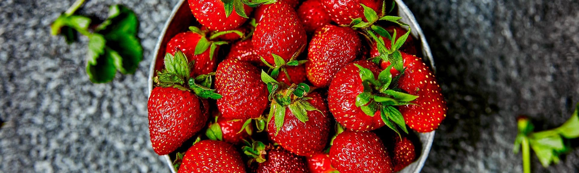 Banner of Strawberries in grey bowl. Fresh strawberries. Beautiful strawberries.